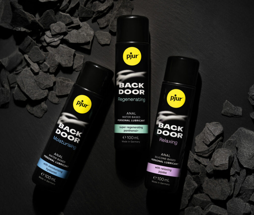 pjur lube bottles on dark background