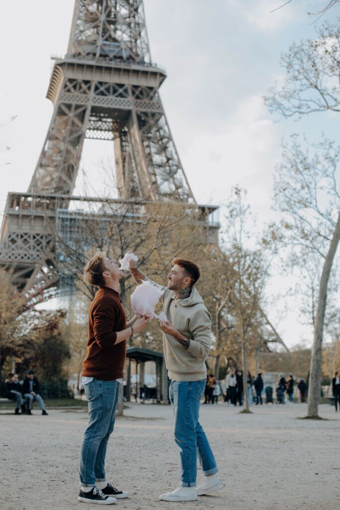 Michael and Tim Overdick are standing in front of the Eiffel Tower in Paris.