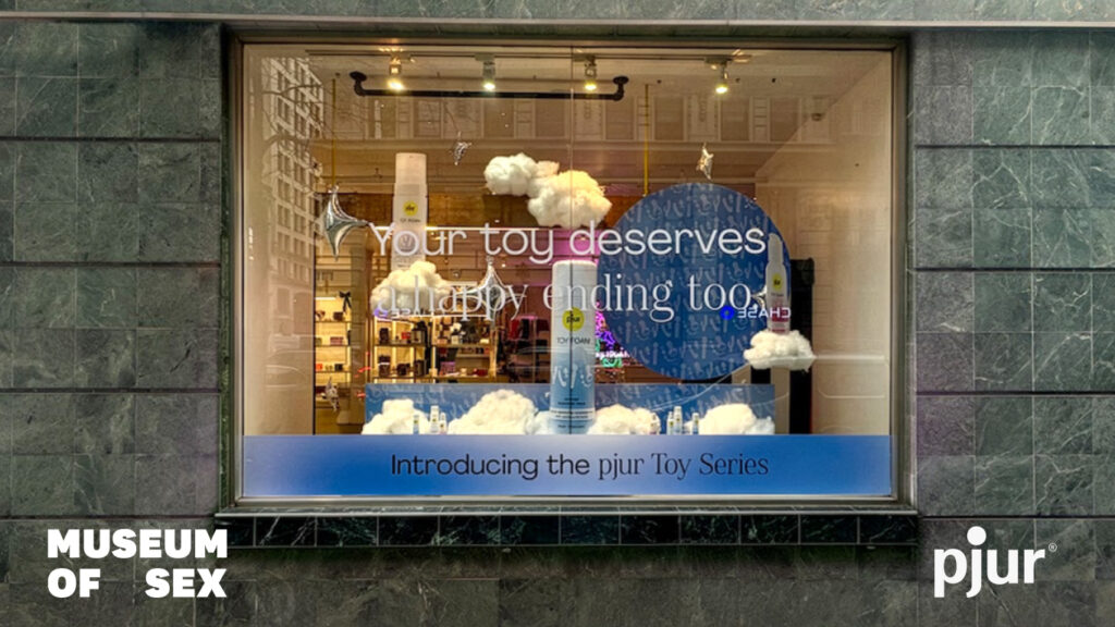 The TOY Range products are decoratively showcased behind a storefront window.